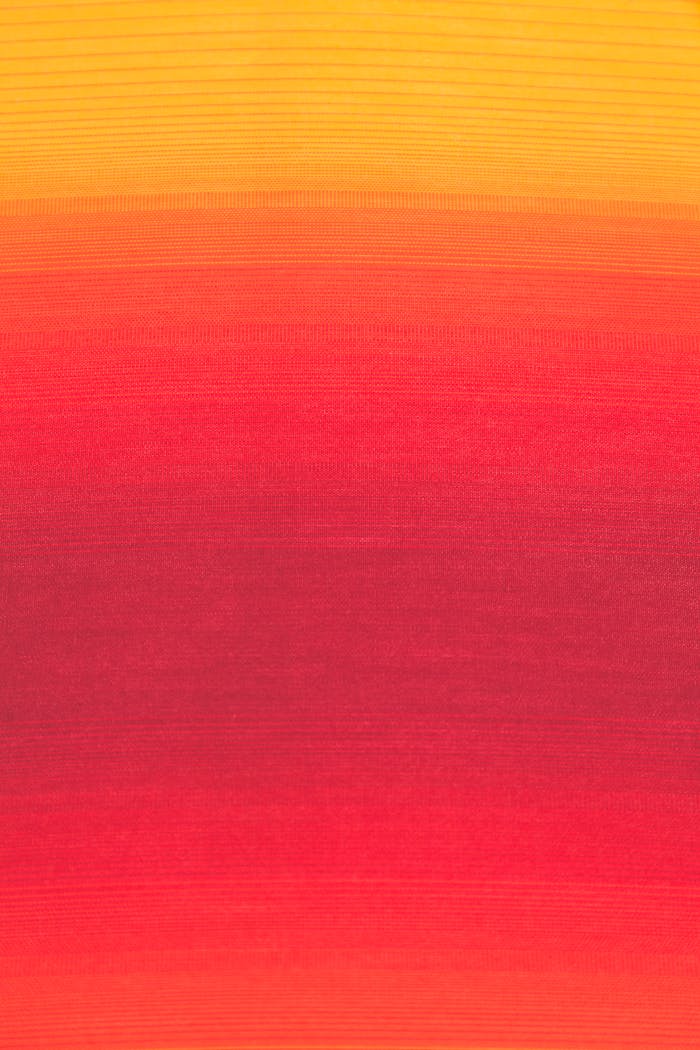 Bright and colorful gradient design in red and yellow hues, ideal for backgrounds and textiles.